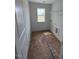 Bright laundry room with a window offering natural light and ample space for washer, dryer and storage at 111 Demascus Way # 021, Four Oaks, NC 27524