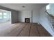 The living room includes a fireplace and staircase, blending comfort and architectural interest at 111 Demascus Way # 021, Four Oaks, NC 27524