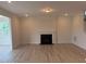Bright living room with a fireplace and freshly painted walls at 111 Demascus Way # 021, Four Oaks, NC 27524