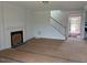 Living room showcasing a fireplace and staircase at 111 Demascus Way # 021, Four Oaks, NC 27524