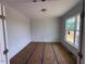 Bright living room with decorative molding and large windows at 111 Demascus Way # 021, Four Oaks, NC 27524