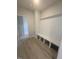 Convenient mudroom with built-in bench and storage at 111 Demascus Way # 021, Four Oaks, NC 27524