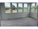 A sun room with lots of windows overlooking green landscape at 111 Demascus Way # 021, Four Oaks, NC 27524