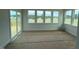 Sun Room with a series of windows that frame an expansive view and a sliding glass door to a deck at 111 Demascus Way # 021, Four Oaks, NC 27524