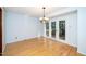 Dining room features hardwood floors and sliding glass doors to deck at 5940 Whitebud Dr, Raleigh, NC 27609