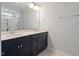 Bathroom showcasing double vanity with modern fixtures, elegant hardware, and neutral countertops at 9216 Leaning Post Rd # 447, Wake Forest, NC 27587