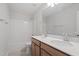 Bright bathroom featuring a double vanity, large mirror, and shower-tub combination at 9216 Leaning Post Rd # 447, Wake Forest, NC 27587