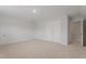 Spacious bedroom showcasing neutral carpet and a double-door closet at 9216 Leaning Post Rd # 447, Wake Forest, NC 27587