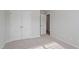 Cozy bedroom boasts plush carpet, neutral walls, and double door closet at 9216 Leaning Post Rd # 447, Wake Forest, NC 27587