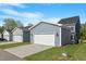 Detached garages offering ample parking and storage space with clean, paved driveways and manicured lawns at 9216 Leaning Post Rd # 447, Wake Forest, NC 27587