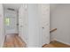 Hallway with ample storage and hardwood floors leading to other areas of the house at 9216 Leaning Post Rd # 447, Wake Forest, NC 27587