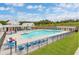 Community pool featuring lounge seating and a covered area at 9216 Leaning Post Rd # 447, Wake Forest, NC 27587