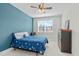 View of a bedroom with a blue accent wall at 120 W Weatherford Dr, Angier, NC 27501