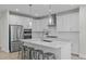 Kitchen with island, stainless steel appliances and bar stool seating at 120 W Weatherford Dr, Angier, NC 27501