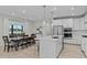 Open kitchen and dining area with large island, stainless steel appliances at 120 W Weatherford Dr, Angier, NC 27501