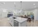 Open concept kitchen with center island and view of living space at 120 W Weatherford Dr, Angier, NC 27501