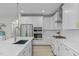 Kitchen with stainless steel appliances, tile backsplash, and white cabinetry at 120 W Weatherford Dr, Angier, NC 27501