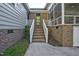 Brick steps leading to a screened porch and backyard at 1604 Burnt Mill Rd, Rocky Mount, NC 27804