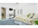 Bright bedroom with a floral comforter and ensuite bathroom access at 1604 Burnt Mill Rd, Rocky Mount, NC 27804
