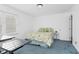 Cozy bedroom featuring a floral bedspread and ample natural light at 1604 Burnt Mill Rd, Rocky Mount, NC 27804