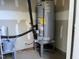 Utility room with water heater and storage at 3016 Old Craig Trail, Mebane, NC 27302