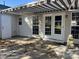 Covered patio with striped awning and table at 3016 Old Craig Trail, Mebane, NC 27302