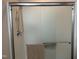 Updated shower with glass doors and tan towel at 3016 Old Craig Trail, Mebane, NC 27302