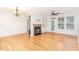 Bright living room with hardwood floors, fireplace, and built-in shelving at 100 Northbrook Dr # 106, Raleigh, NC 27609