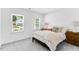 Bright bedroom featuring neutral decor, a window view, and soft carpet at 114 Hickory Grove Dr, Sanford, NC 27330