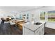 Bright kitchen with a large island, stainless steel appliances, and open to living area at 114 Hickory Grove Dr, Sanford, NC 27330