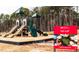 View of the community tot lot and play area with modern equipment and safety features at 114 Hickory Grove Dr, Sanford, NC 27330