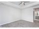 Bedroom with tray ceiling, ceiling fan, carpeted floor, and en suite bathroom at 1230 Linkwood, Homesite 44, Fuquay Varina, NC 27526