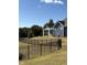 A wide shot of the home's exterior reveals blue siding and white trim, complemented by well-manicured landscaping at 1230 Linkwood, Homesite 44, Fuquay Varina, NC 27526