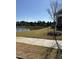 This outdoor space has a view of a backyard pond with a black fence for safety and clear property boundary at 1230 Linkwood, Homesite 44, Fuquay Varina, NC 27526