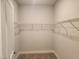 Walk-in closet with carpeted floor and wire shelving at 1230 Linkwood, Homesite 44, Fuquay Varina, NC 27526