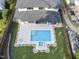 Beautiful backyard featuring a swimming pool, hot tub, fire pit, and lush landscaping at 662 Manchester Dr, Raleigh, NC 27609