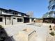 The backyard has an outdoor pool, fire pit, stone tile, and a modern two-story home at 662 Manchester Dr, Raleigh, NC 27609