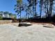 A spacious backyard includes an unfinished swimming pool, hot tub, custom tile, and a wood fence at 662 Manchester Dr, Raleigh, NC 27609