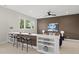 Stylish home bar with seating, shelving, and views from the window at 662 Manchester Dr, Raleigh, NC 27609