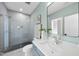 Modern bathroom featuring a glass-enclosed shower and sleek vanity with stylish mirror at 662 Manchester Dr, Raleigh, NC 27609