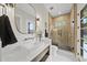 Modern bathroom with a vessel sink, stylish mirror, and glass-enclosed shower at 662 Manchester Dr, Raleigh, NC 27609