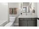 Stylish bathroom with modern vanity, fixtures, and decorative tile accents at 662 Manchester Dr, Raleigh, NC 27609