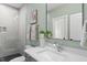 Clean bathroom with stylish lighting, modern fixtures, and decorative elements at 662 Manchester Dr, Raleigh, NC 27609