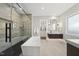 Luxurious bathroom featuring a soaking tub, walk-in shower and a view to the walk-in closet at 662 Manchester Dr, Raleigh, NC 27609