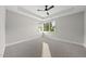 Spacious bedroom with tray ceilings and large windows, offering plenty of natural light at 662 Manchester Dr, Raleigh, NC 27609