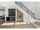 Welcoming entryway with modern staircase, stylish wet bar, and stunning wood floors at 662 Manchester Dr, Raleigh, NC 27609