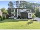 Stunning two-story home with modern design, manicured lawn, and elegant landscaping at 662 Manchester Dr, Raleigh, NC 27609