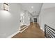 Long hallway showcasing hardwood floors and stylish decor at 662 Manchester Dr, Raleigh, NC 27609