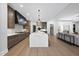 Spacious kitchen featuring a marble island, modern appliances, and open layout to the living area at 662 Manchester Dr, Raleigh, NC 27609