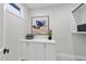 Well-organized laundry room with ample storage space and modern decor at 662 Manchester Dr, Raleigh, NC 27609